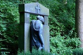 sculpture of a girl on a tombstone in a cemetery in Weststadt