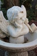 white stone angel with wings