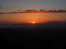 sunset in the clouds over the bay of palma