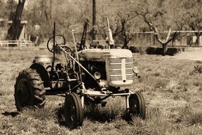 retro photo of a tractor on a farm in New Mexico