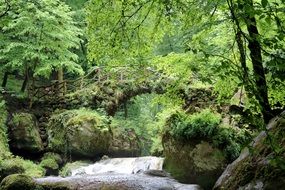 picturesque ancient stone Bridge across River at forest luxembourg, Mullerthal