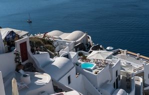 white village on the coast of Greece in the summer