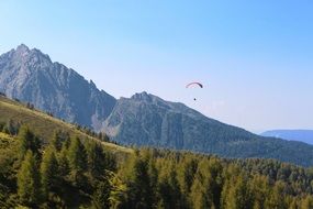 landscape of paragliding over the mountains on a clear sunny day