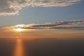 blue sky and orange sunset over the ocean