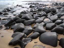 black stones on the beach