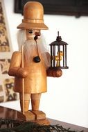 wooden figure in the form of a smoking person