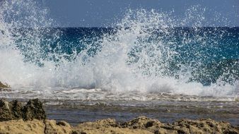 spraying sea waves on the beach