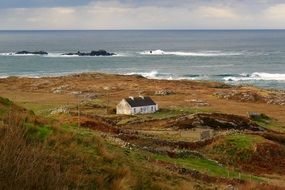 Beautiful landscape with the Coastal Cottage near the ocean