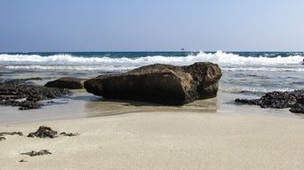 stones on the sandy coast near the sea