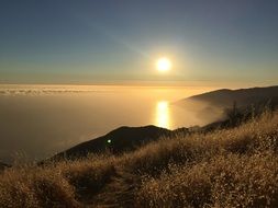 sunset over the cliffs on the coast