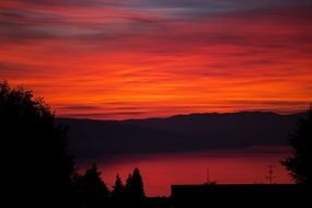 red sky over the mountains at dusk