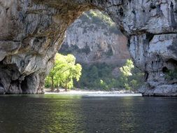 stone natural bridge over the river in Vallon-Pont-d'Arc