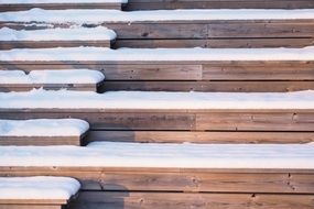 snow on wooden steps