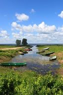 picturesque summer Landscape with boats on calm River