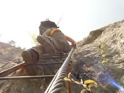man on climbing platform system