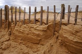 wooden fence on Sand Dune, erosion barrier
