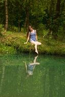 scene of sensual Girl in Forest near Water