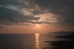 sunset over the coast in brittany