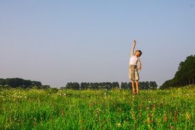 boy jumping in Freedom Meadow Spring scene