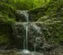 landscape of small waterfall in the valley