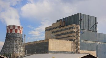 Powerful electric plant at blue sky with white clouds on background in Bosnia and Herzegovina