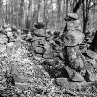 black and white photo of balanced stones