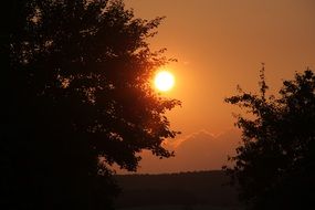 Romantic colorful and bright sunset at dusk above the landscape