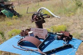 metal objects on a blue blanket in a desert in new mexico