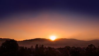 beautiful morning sun over misty mountains