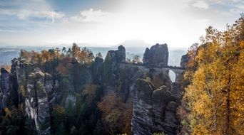 Beautiful and colorful landscape of the rockwall with plants in autumn