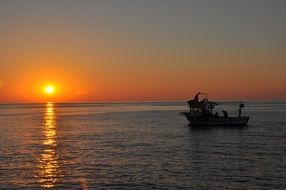 Sailing boat on the beautiful water at colorful sunset in Istanbul, Turkey