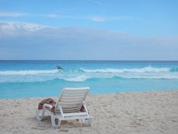 deck chair on the beach near the ocean