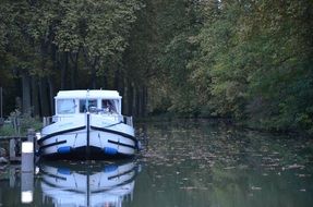 white motor Boat on Water at pier