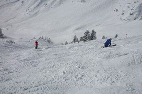 Skiing humans on a wintry mountain