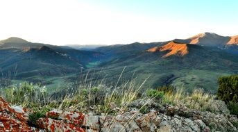 sunrise over the green mountains