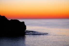 orange sky at sunrise over the ocean