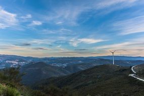 distant view of a wind turbine in the mountains