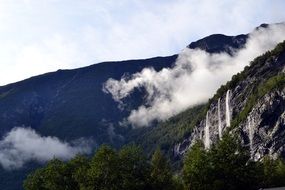 Waterfall and haze, mountain Landscape