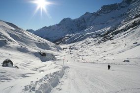 Panorama of the beautiful snowy ski slope with a person in the resort of Cervinia in Italy