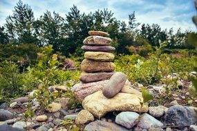 stone tower on a green shore