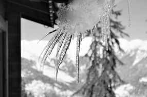 icicles near a chalet close-up on a blurred background