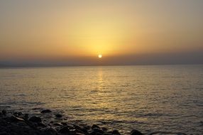 bright sun at sunset over the coast of Crimea