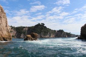 ocean waves and rocky shore at Whitianga, New Zealand