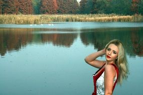 blonde Girl in front of Lake Autumn Tree