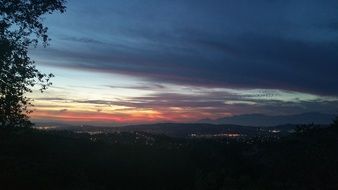 distant view of the illuminated city at dusk