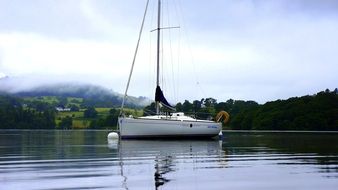 white boat on a quiet lake