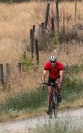 cyclist rides on a track