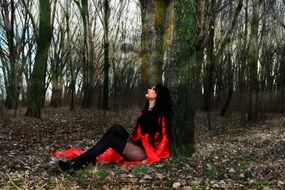 erotic long haired woman in forest