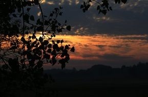 distant view of a village in poland at sunset