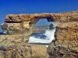 window in a rock on the coast of Malta